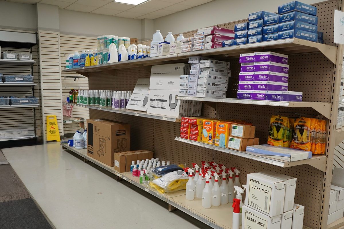 The janitorial supply aisle, stocked with gloves, spray bottles, dusters and cleaning consumables